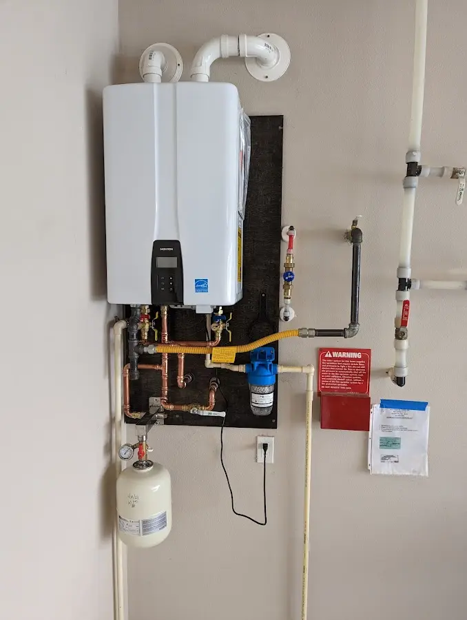 Professional plumber installing copper piping in a Radcliff home