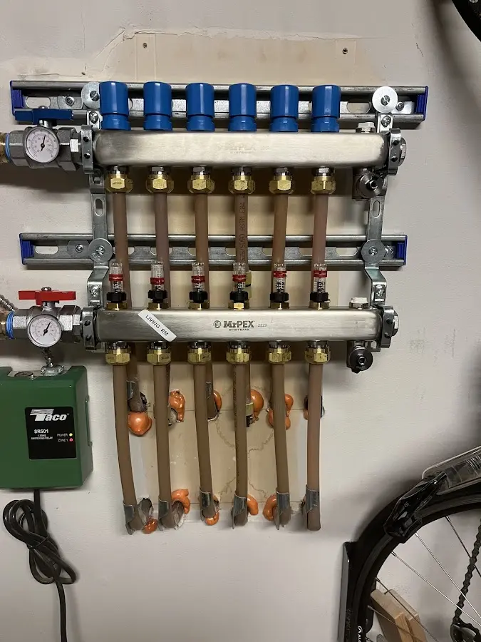 Plumber performing Water Heater Repair at a residential property in Radcliff